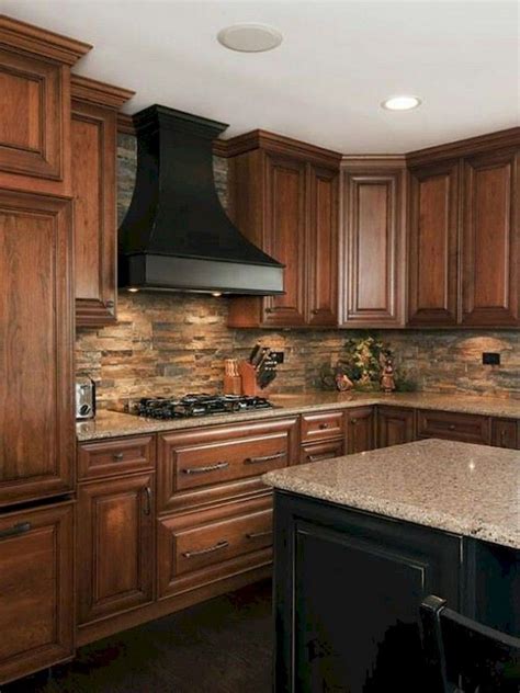 best backsplash for wood cabinets and black stainless steel|black cabinets with brick backsplash.